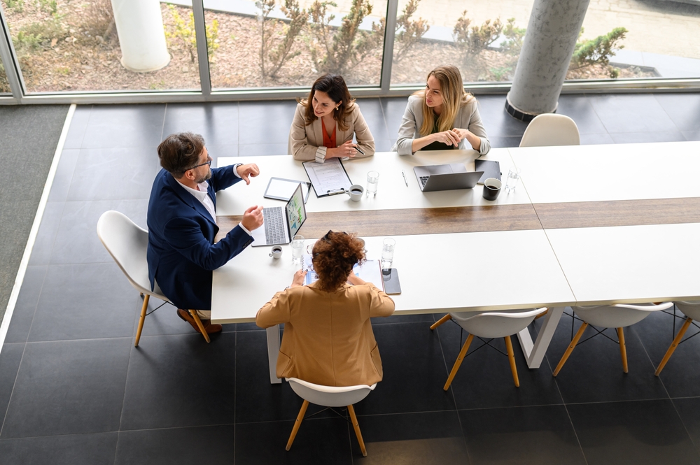 high,angle,view,of,business,professionals,with,technologies,and,documents